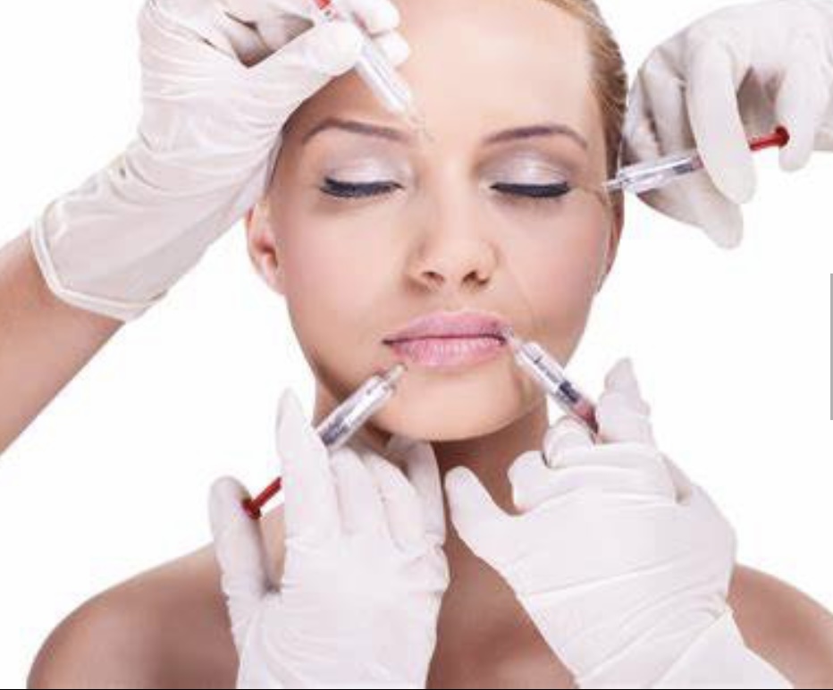Woman with eyes closed receiving facial injections of Botox.